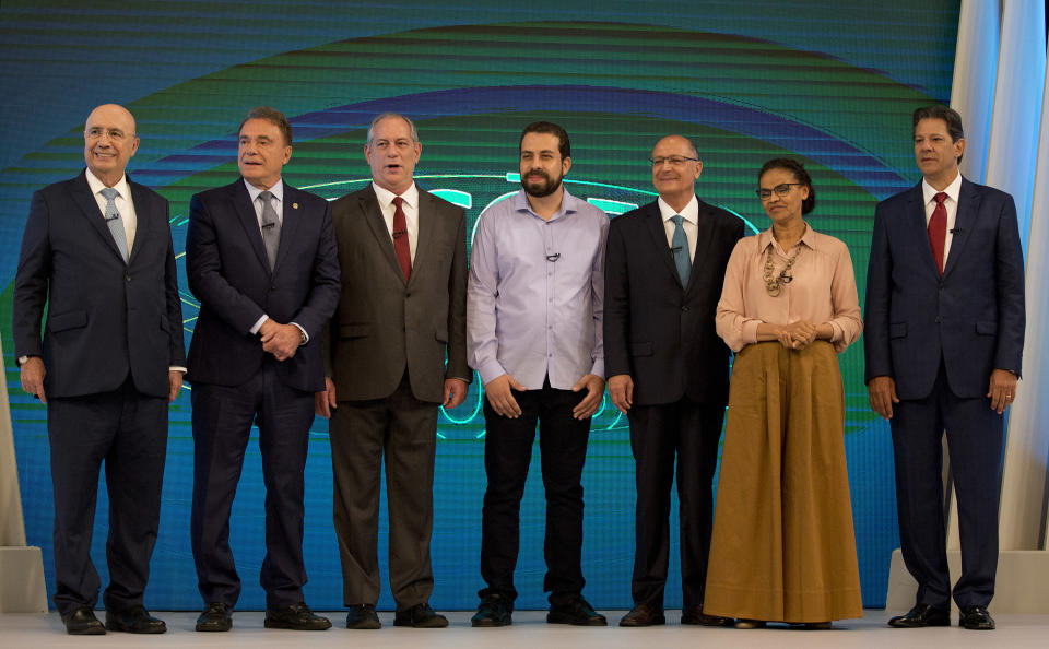 Brazilian presidential candidates pose for a photo before a live, televised debate in Rio de Janeiro, Brazil, Thursday, Oct. 4, 2018, ahead of Oct. 7 general elections. From left are Henrique Meirelles of the Democratic Movement Party, Alvaro Dias of Podemos Party, Ciro Gomes of the Democratic Labor Party, Guilherme Boulos of the Socialism and Liberty Party, Geraldo Alckmin of the Social Democratic Party, Marina Silva of the Sustainability Network Party and Fernando Haddad of the Worker's Party. (AP Photo/Silvia Izquierdo)