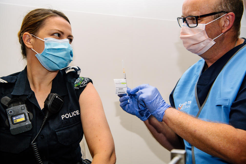 South Australian policewoman Amanda Kuchel receives the Pfizer Vaccine at the Royal Adelaide Hospital in Adelaide on Monday. Source: AAP