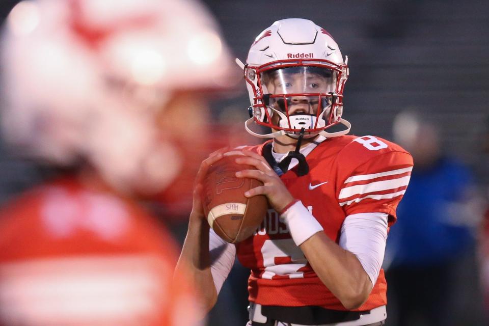 Hudson sophomore quarterback Jake Attaway looks to make a pass prior to a football game against Maynard/AMSA at Hudson High School on Sept. 30, 2022.