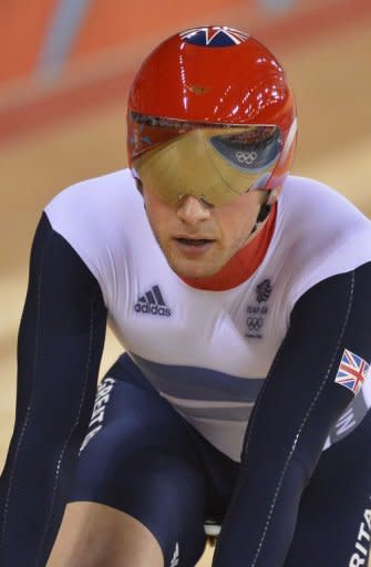 Britain's Jason Kenny crosses the finish line ahead of Malaysia's Azizulhasni Awang during the London 2012 Olympic Games men's sprint quarterfinals cycling event. Chris Hoy could become Britain's most decorated Olympic champion when he lines up in track cycling's keirin event in a bid to defend his Beijing crown