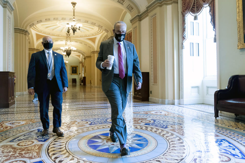 Senate Majority Leader Chuck Schumer of N.Y., arrives as the $1 trillion bipartisan infrastructure package is expected to be voted on by the Senate this morning on Capitol Hill in Washington, Tuesday, Aug. 10, 2021. (AP Photo/Andrew Harnik)