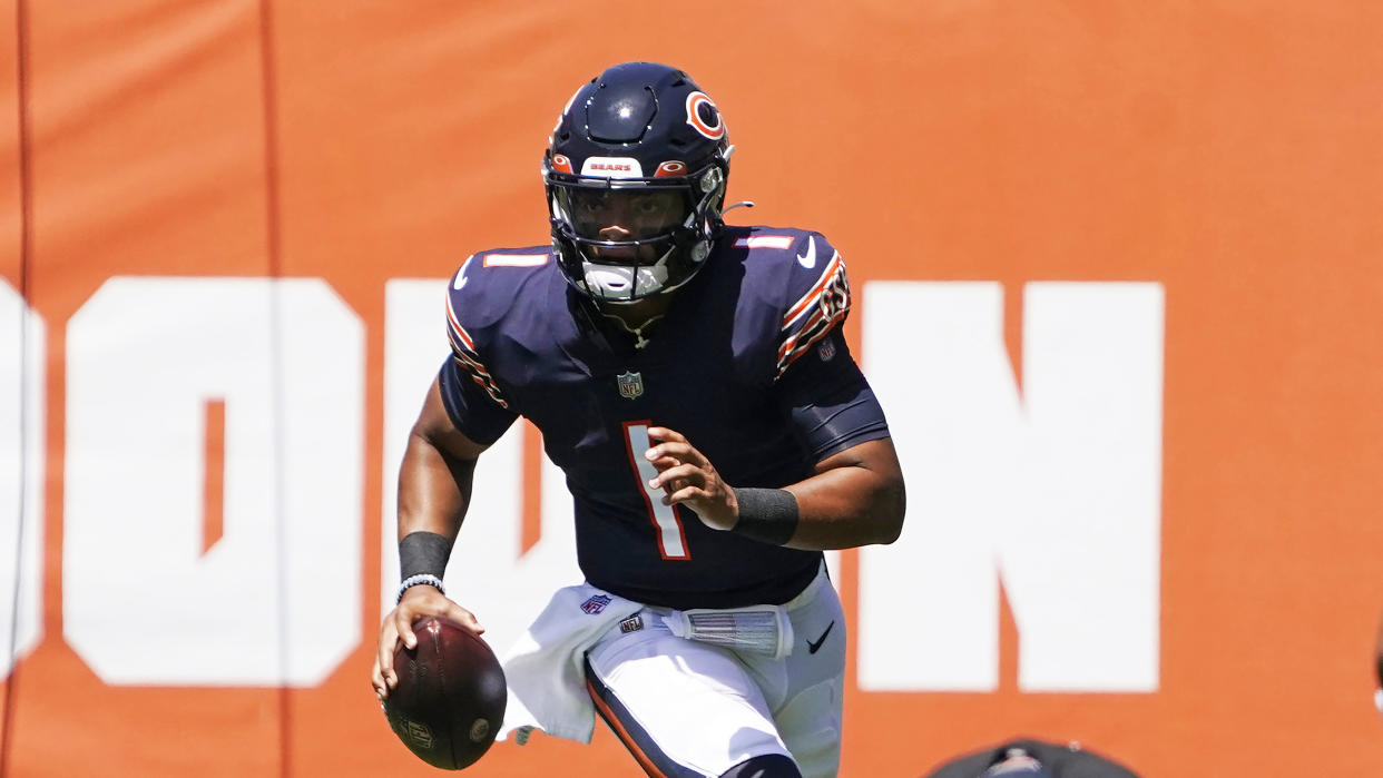 Chicago Bears quarterback Justin Fields (1) plays against the Miami Dolphins during an NFL preseason football game in Chicago, Saturday, Aug. 14, 2021. (AP Photo/David Banks)