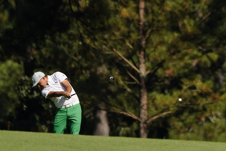 Rickie Fowler hits on the second fairway during the third round of the Masters golf tournament Saturday, Nov. 14, 2020, in Augusta, Ga. (AP Photo/Matt Slocum)