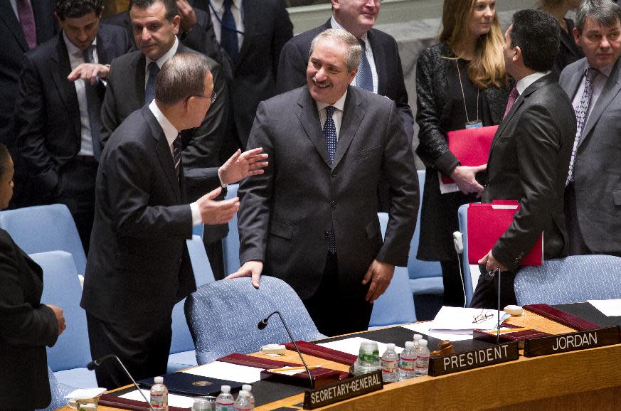 Jordanian Foreign Minister Nasser Judeh , center, speaks with U.N. Secretary-General Ban Ki-moon before a meeting of the United Nations Security Council at U.N. headquarters, Monday, Jan. 20, 2014. (AP Photo/Craig Ruttle)