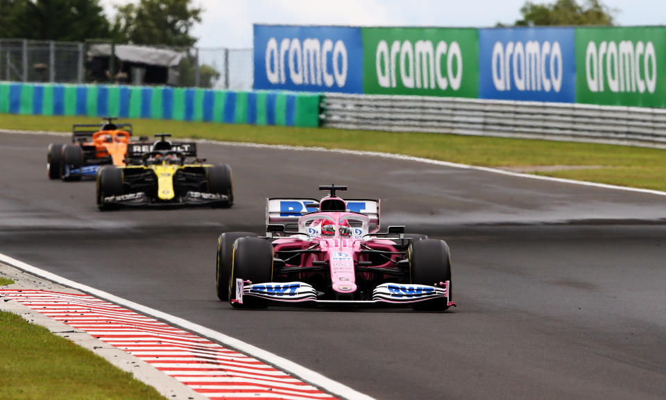 BUDAPEST, HUNGARY - JULY 19: Sergio Perez of Mexico driving the (11) Racing Point RP20 Mercedes leads a line of cars during the Formula One Grand Prix of Hungary at Hungaroring on July 19, 2020 in Budapest, Hungary. (Photo by Bryn Lennon/Getty Images)