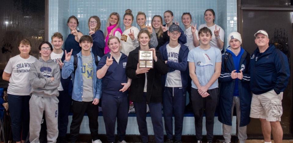 The Shawnee swim teams pose after winning Suburban Conference titles on Thursday.