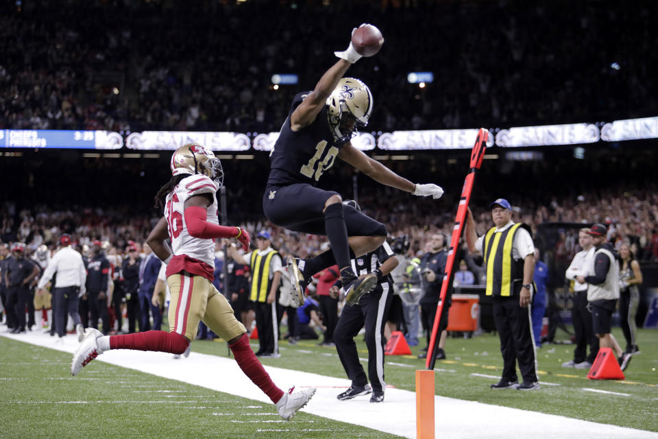 New Orleans Saints wide receiver Tre'Quan Smith (10) scores a touchdown in fronton San Francisco 49ers defensive back Marcell Harris (36) in the second half an NFL football game in New Orleans, Sunday, Dec. 8, 2019. (AP Photo/Brett Duke)