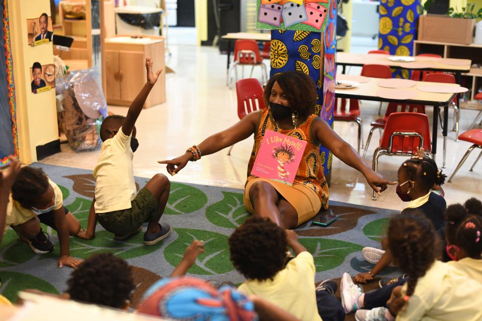 Teacher Aaliyah Barclift reads the book "I Like Myself!" to students at the Little Sun People preschool in the Brooklyn borough of New York City.