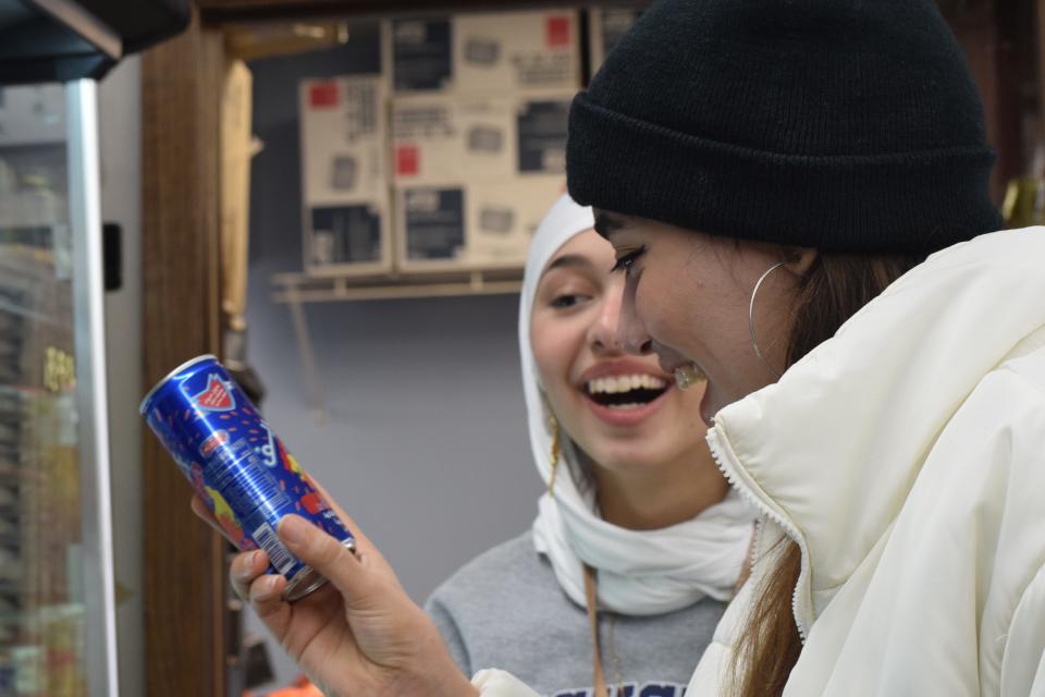 Augustana students Nada Chaabane and Mariam Alinizi explore drinks at Neighborhood Market during an Augustana University Halal market shopping trip Saturday, March 9, 2024, in Sioux Falls, South Dakota.