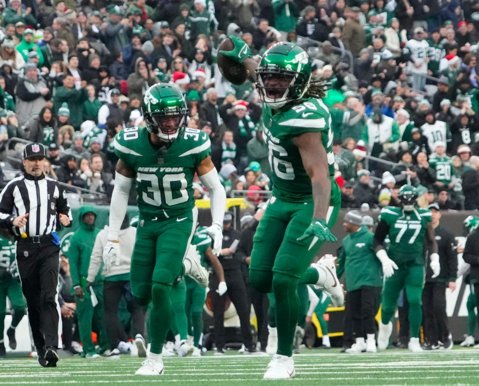 Dec 24, 2023; East Rutherford, New Jersey, USA; New York Jets linebacker Quincy Williams (56) celebrates a second half interception against the <a class="link " href="https://sports.yahoo.com/nfl/teams/washington/" data-i13n="sec:content-canvas;subsec:anchor_text;elm:context_link" data-ylk="slk:Washington Commanders;sec:content-canvas;subsec:anchor_text;elm:context_link;itc:0">Washington Commanders</a> at MetLife Stadium. Mandatory Credit: Robert Deutsch-USA TODAY Sports