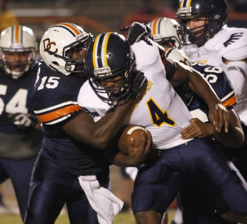Northeast quarterback Jalen Reeves-Maybin fights for extra yards against Dickson County during a football game in 2012. Reeves-Maybin was selected to The Leaf-Chronicle All Decade Football team.