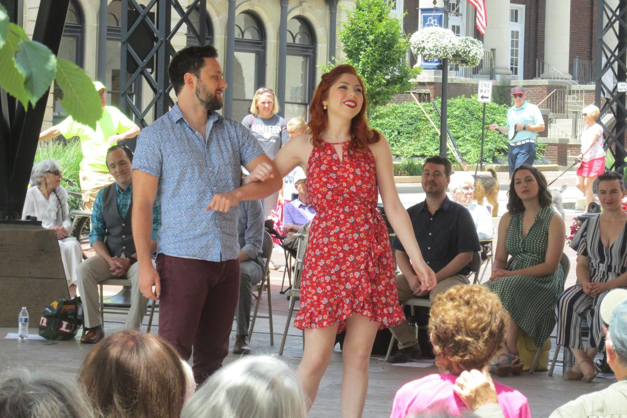 Ohio Light Opera members Caitlyn Ruddy and Mark Hosseinni perform a duet from the musical "Brigadoon" during a free presentation last year on the square during Second Saturday in Wooster.