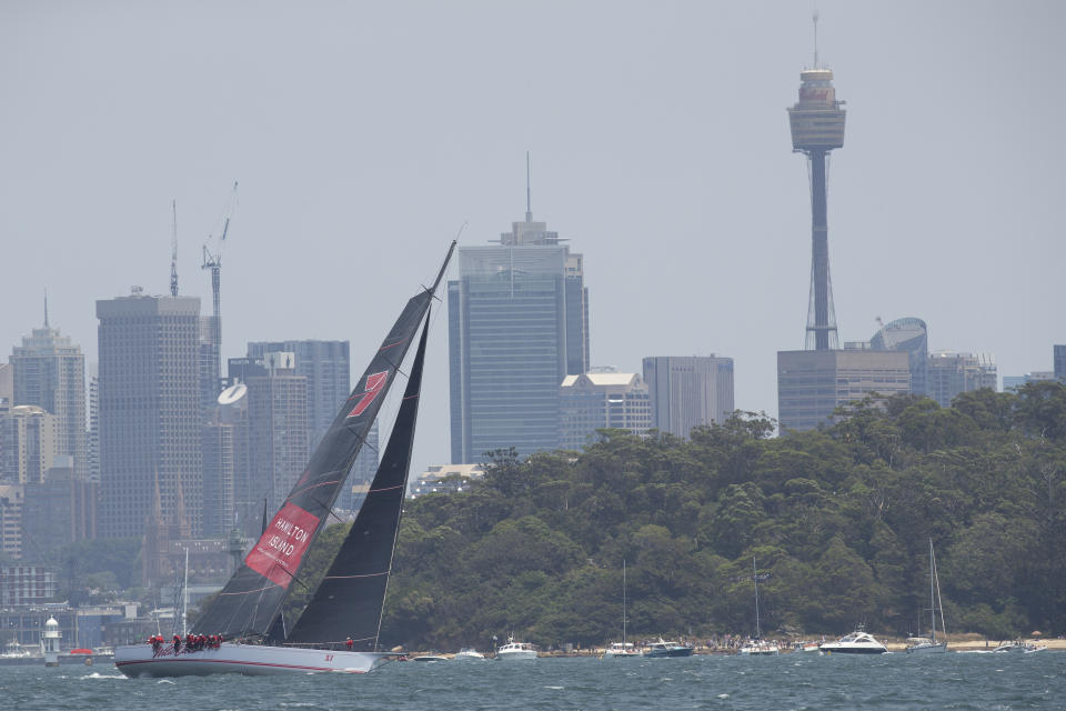 Wild Oats XI heads up Sydney Harbour during the start of the Sydney Hobart yacht race in Sydney, Australia, Thursday, Dec. 26, 2019. (AP Photo/Steve Chirsto)