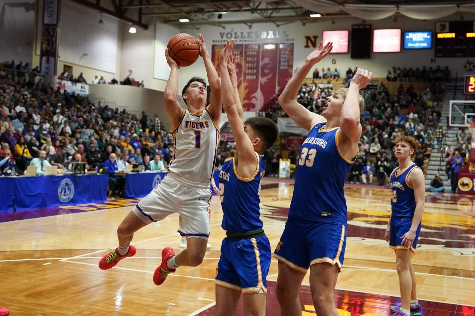 Nicolas Marshall (1) drives to the rim against Castlewood in the Class B third place game.