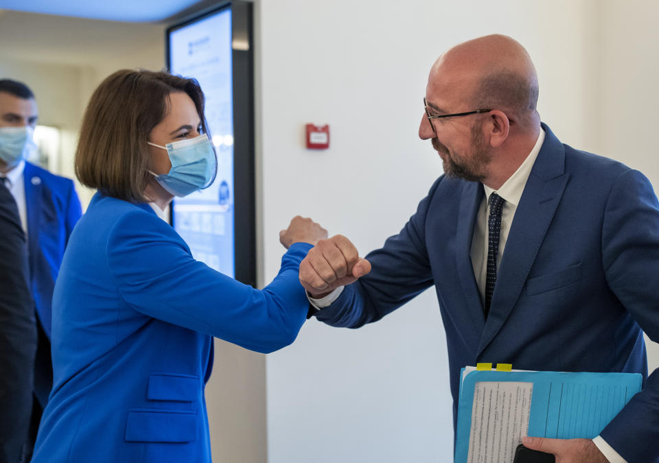 European Council President Charles Michel, right, greets Belarusian opposition leader Svetlana Tikhanovskaya prior to their meeting in Vilnius, Lithuania, Tuesday, July 6, 2021. (AP Photo/Mindaugas Kulbis)