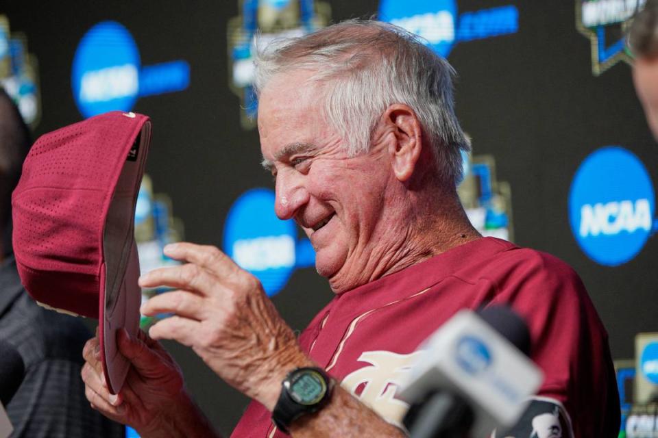 Florida State NCAA college baseball coach Mike Martin removes his cap at the start of a news conference at TD Ameritrade Park in Omaha, Neb., Friday, June 14, 2019. Florida State will be trying to win retiring coach and NCAA all-time wins leader Martin’s first national championship in his 17 visits to Omaha, is playing Arkansas on Saturday in the College World Series. (AP Photo/Nati Harnik) Nati Harnik/AP