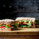<p>This mile-high vegetable and hummus sandwich makes the perfect heart-healthy vegetarian lunch to go. Mix it up with different flavors of hummus and different types of vegetables depending on your mood.</p>