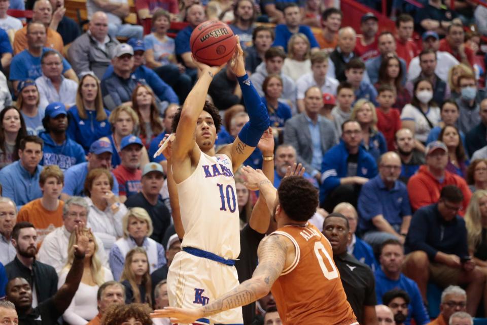 Kansas redshirt sophomore Jalen Wilson (10) lines up a three-pointer against Texas during the first half of Saturday's game inside Allen Fieldhouse.