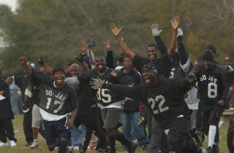 The Creekwood Soljas storm the field in response to their team's overtime victory over the Jervay Bulldogs  in the annual Turkey Bowl football game in Wilmington in 2003.