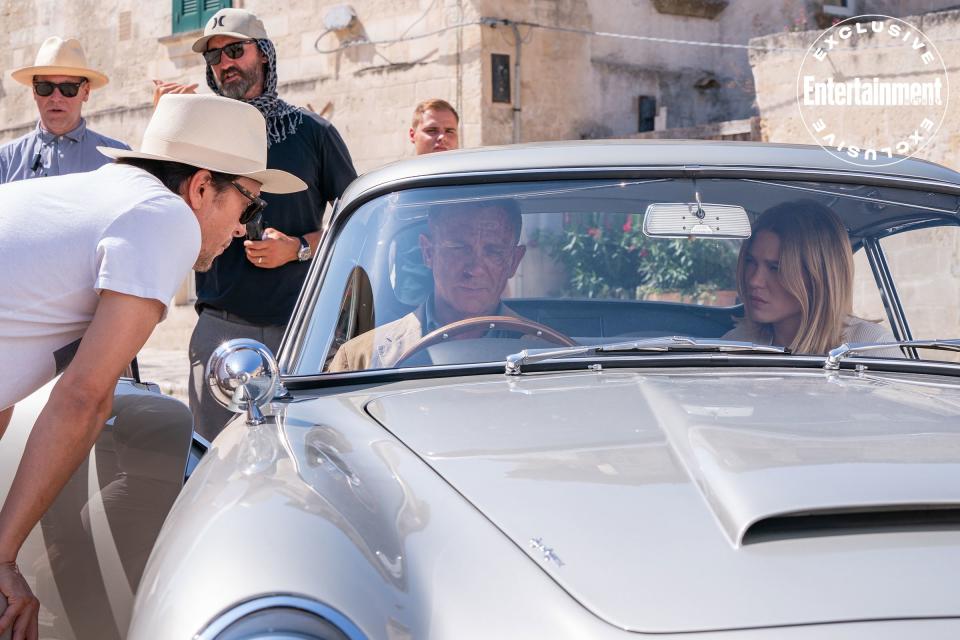 A behind-the-scenes shot of Craig at the wheel of Bond’s vintage Aston Martin, shooting in the Italian town of Matera. “I managed to actually do some driving,” says the actor. “I did some doughnuts!”