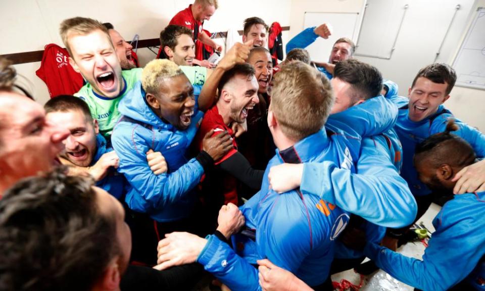 Brackley Town players celebrate their victory over Gillingham in the FA Cup first round