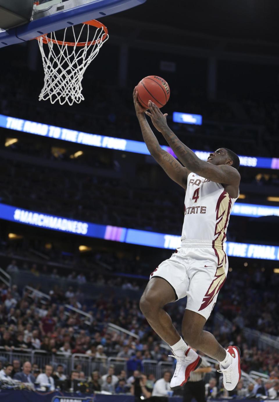 Florida State guard Dwayne Bacon goes up for a shot during the first half of the first round of the NCAA college basketball tournament against Florida Gulf Coast, Thursday, March 16, 2017 in Orlando, Fla. (AP Photo/Gary McCullough)