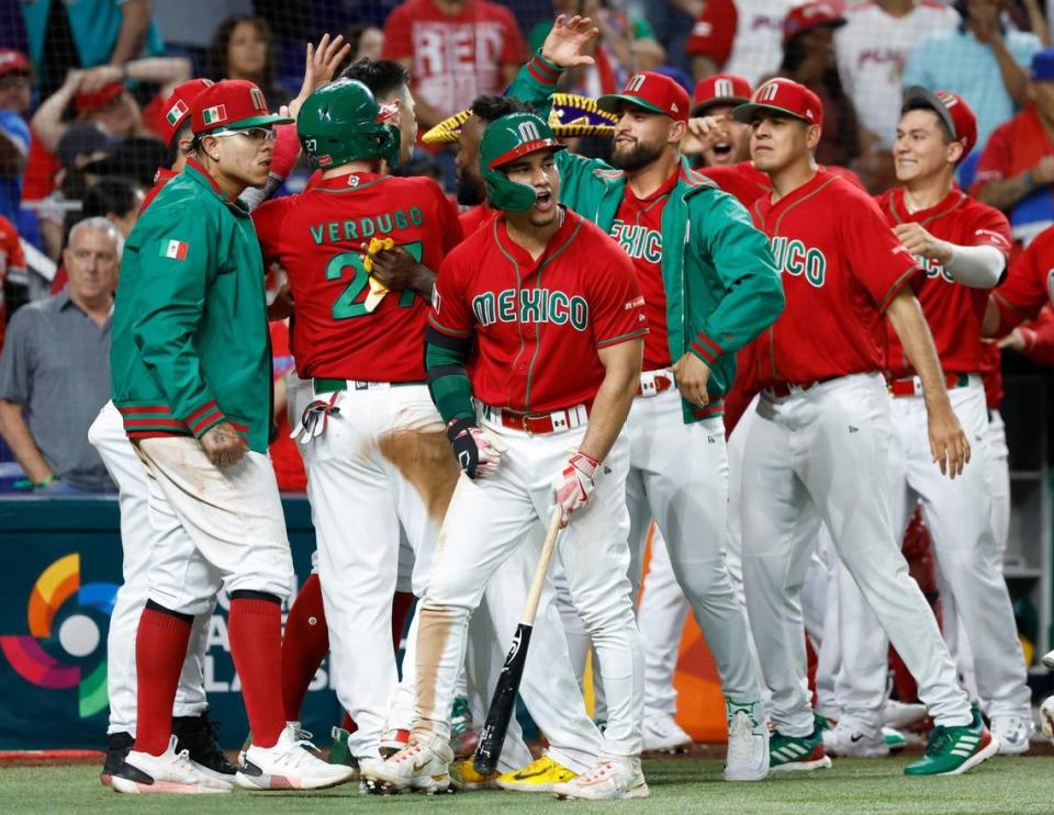 Mexico team reacts after Alex Verdugo (27) scores to take the lead against Puerto Rico in the 7th inning during the World Baseball Classic quarterfinal at Marlins Park in Miami on Friday, March 17, 2023.
