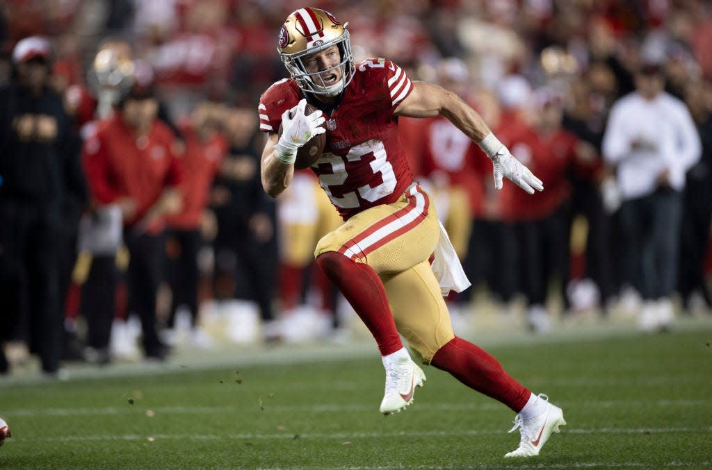 Christian McCaffrey of the San Francisco 49ers rushes during the NFC Championship game against the Detroit Lions on January 28, 2024
