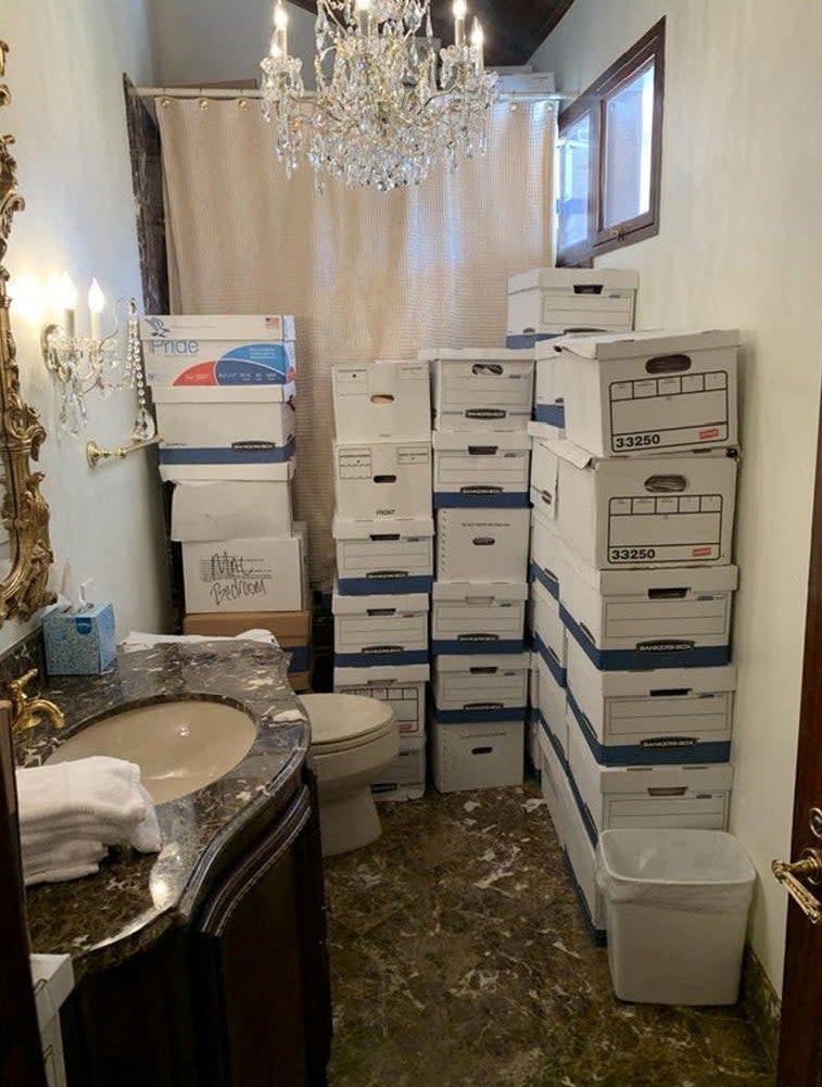 A photo published by the U.S. Justice Department in their charging document against former U.S. President Donald Trump shows boxes of documents stored in a bathroom at Trump’s Mar-a-Lago club in Florida in early 2021 (Justice Department via REUTERS)