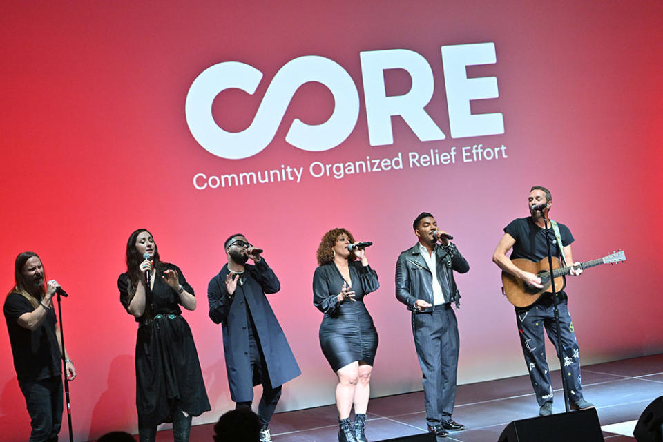 Chris Martin (R) performs during CORE's Pre-Oscars Benefit: An Evening Supporting Communities In Crisis at Ross House on March 05, 2024 in Los Angeles, California.