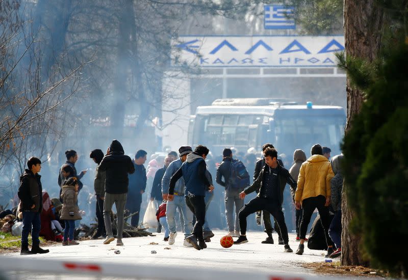 Group of migrants waiting on no man's land between Turkey and Greece, at the Turkeys Pazarkule border crossing with Greece's Kastanies