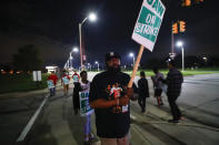 United Auto Workers members picket outside the General Motors Detroit-Hamtramck assembly plant in Hamtramck, Mich., early Monday, Sept. 16, 2019. Roughly 49,000 workers at General Motors plants in the U.S. planned to strike just before midnight Sunday, but talks between the UAW and the automaker will resume. (AP Photo/Paul Sancya)