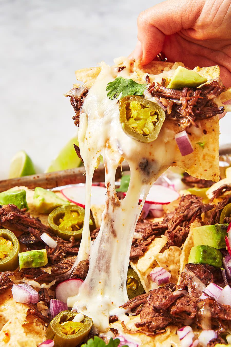 <p>Who doesn't love a big tray of nachos? These are particularly good, considering they're loaded with delicious, tender braising steak. </p><p>Get the <a href="https://www.delish.com/uk/cooking/recipes/a30386864/instant-pot-nachos-recipe/" rel="nofollow noopener" target="_blank" data-ylk="slk:Instant Pot Shredded Beef Nachos;elm:context_link;itc:0;sec:content-canvas" class="link ">Instant Pot Shredded Beef Nachos</a> recipe.</p>