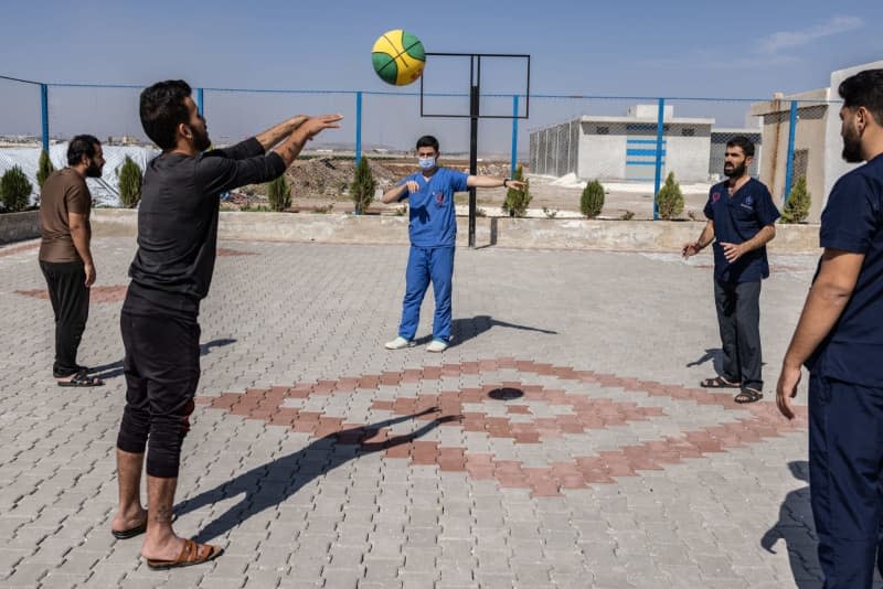 Patients undergoing rehabilitation from substance addiction, do sports at the anti-addiction unit of the Physicians Across Continents (PAC) hospital in Aleppo. The hospital treats cases of addiction and mental illness in Aleppo Governorate. Anas Alkharboutli/dpa