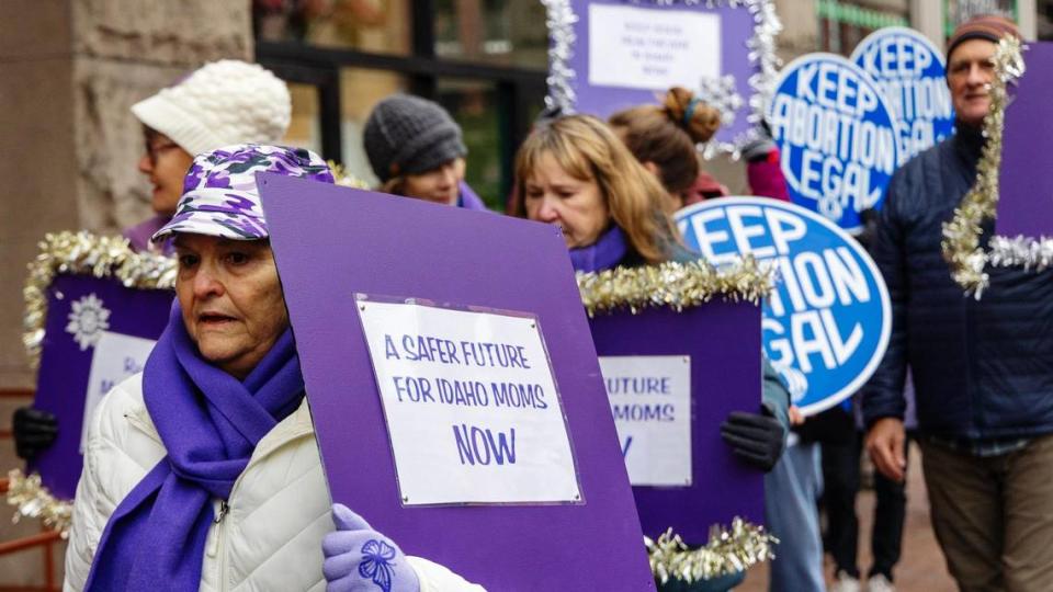 Julia Christensen marches with the Southwest Idaho chapter of the National Organization for Women Friday in downtown Boise to call attention to women’s health care issues. Sarah A. Miller/smiller@idahostatesman.com