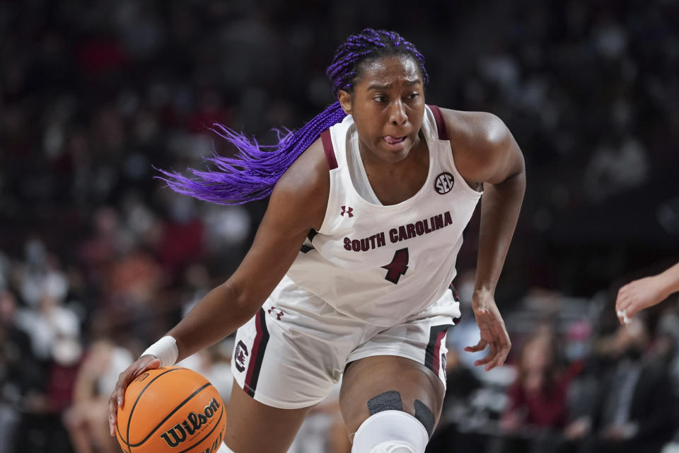 FILE - South Carolina forward Aliyah Boston dribbles the ball during the first half of the team's NCAA college basketball game against Stanford on Tuesday, Dec. 21, 2021, in Columbia, S.C. Boston is a unanimous choice to the women's Associated Press preseason All-America team, Tuesday, Oct. 25, 2022. (AP Photo/Sean Rayford, File)