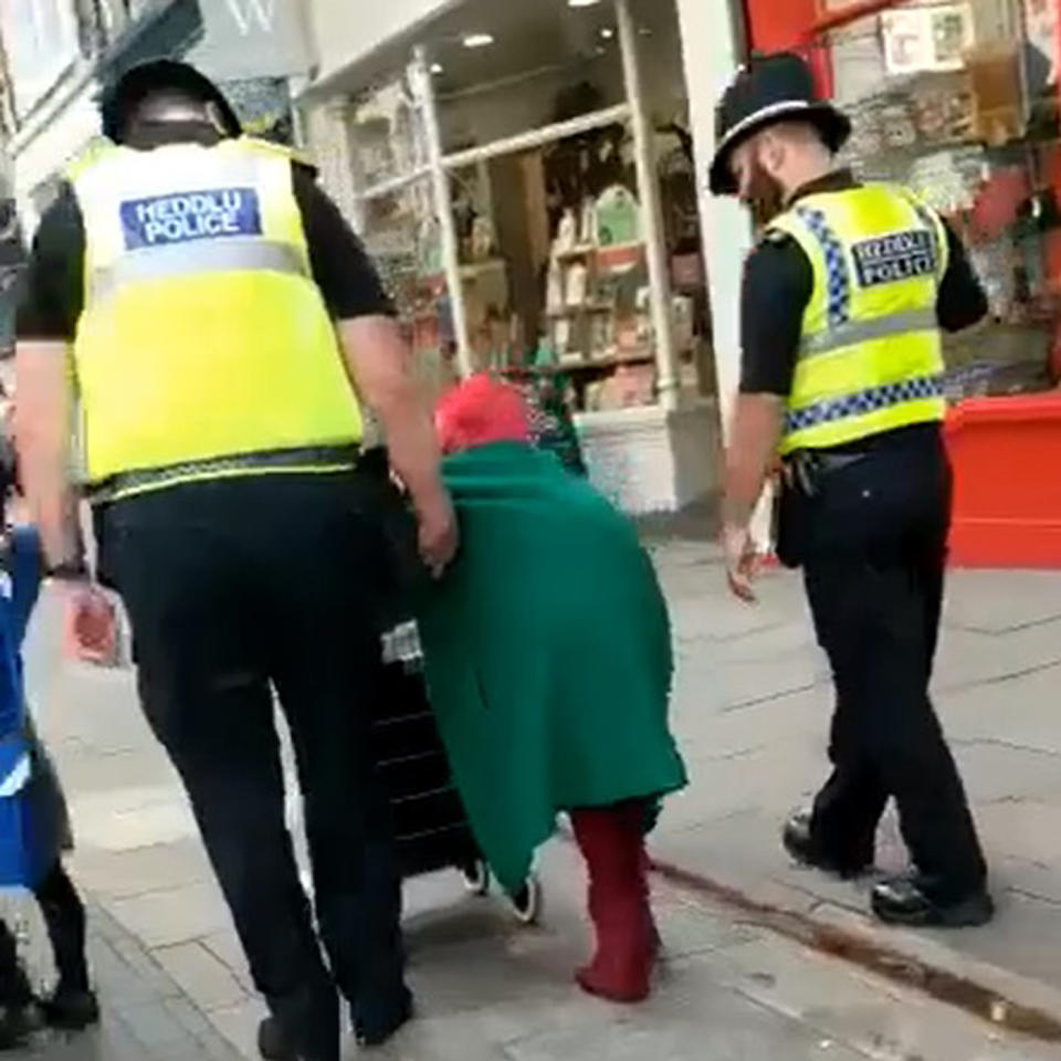 Officers escorted the elderly pensioner as she did her weekly shop. Source: Kennedy News and Media