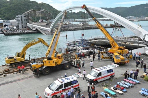 Six people are thought to be trapped after the bridge collapsed onto a group of fishing boats