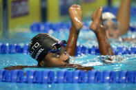 Simone Manuel looks up at her time after swimming in the women's 50 freestyle during wave 2 of the U.S. Olympic Swim Trials on Saturday, June 19, 2021, in Omaha, Neb. (AP Photo/Jeff Roberson)