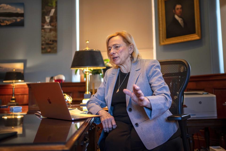 Gov. Janet Mills speaks with a visitor in her office at the State House, Tuesday, Jan. 17, 2023, in Augusta, Maine. Mills, who frequently writes poetry, said she remains convinced that poetry and the arts are essential to being well-rounded and understanding the world. (AP Photo/Robert F. Bukaty)