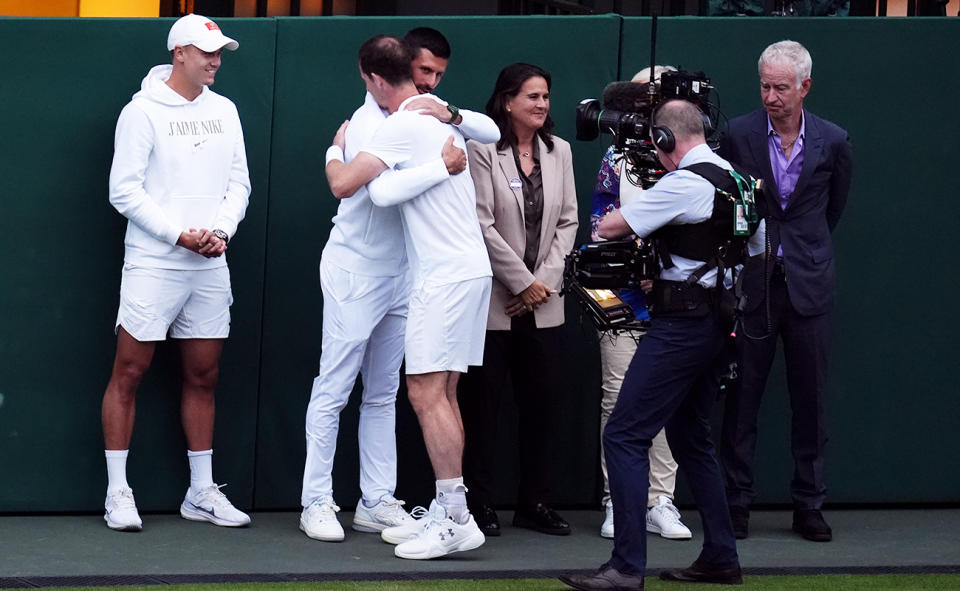 Andy Murray, pictured here sharing a warm embrace with Novak Djokovic.