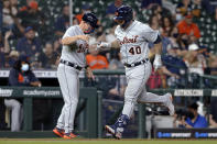 Detroit Tigers third base coach Chip Hale, left, celebrates with Wilson Ramos (40), who had hit a two-run home run against the Houston Astros during the fifth inning of a baseball game Tuesday, April 13, 2021, in Houston. (AP Photo/Michael Wyke)