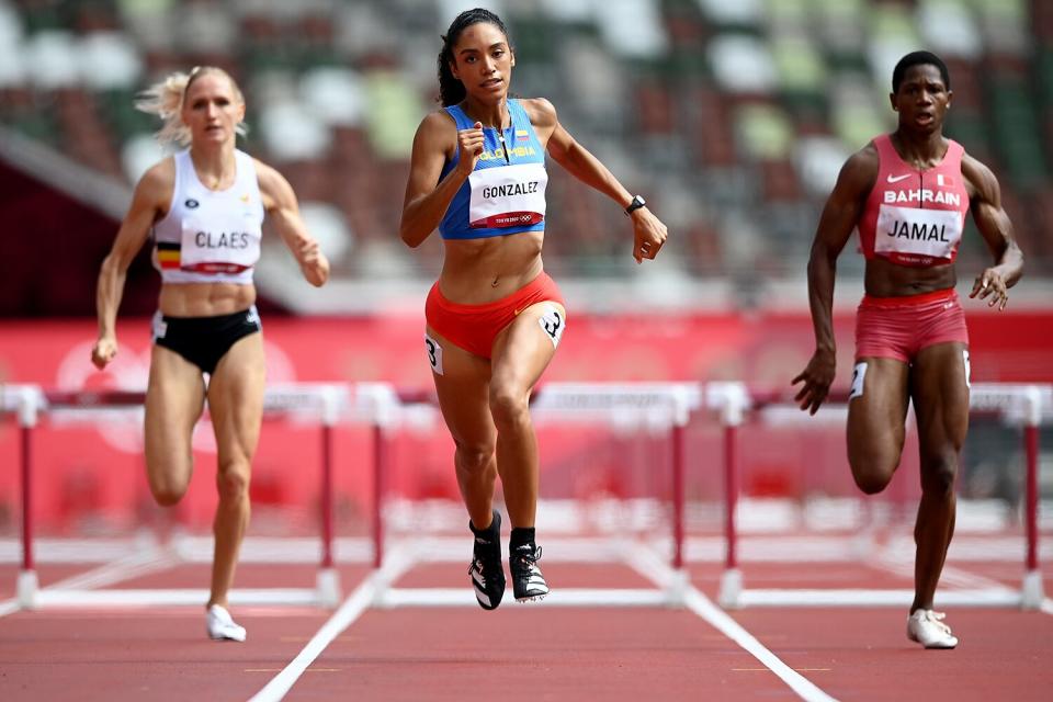 Melissa Gonzalez (C) of Team Colombia competes in round one of the Women's 400m hurdles heats on day eight of the Tokyo 2020 Olympic Games at Olympic Stadium on July 31, 2021 in Tokyo, Japan.