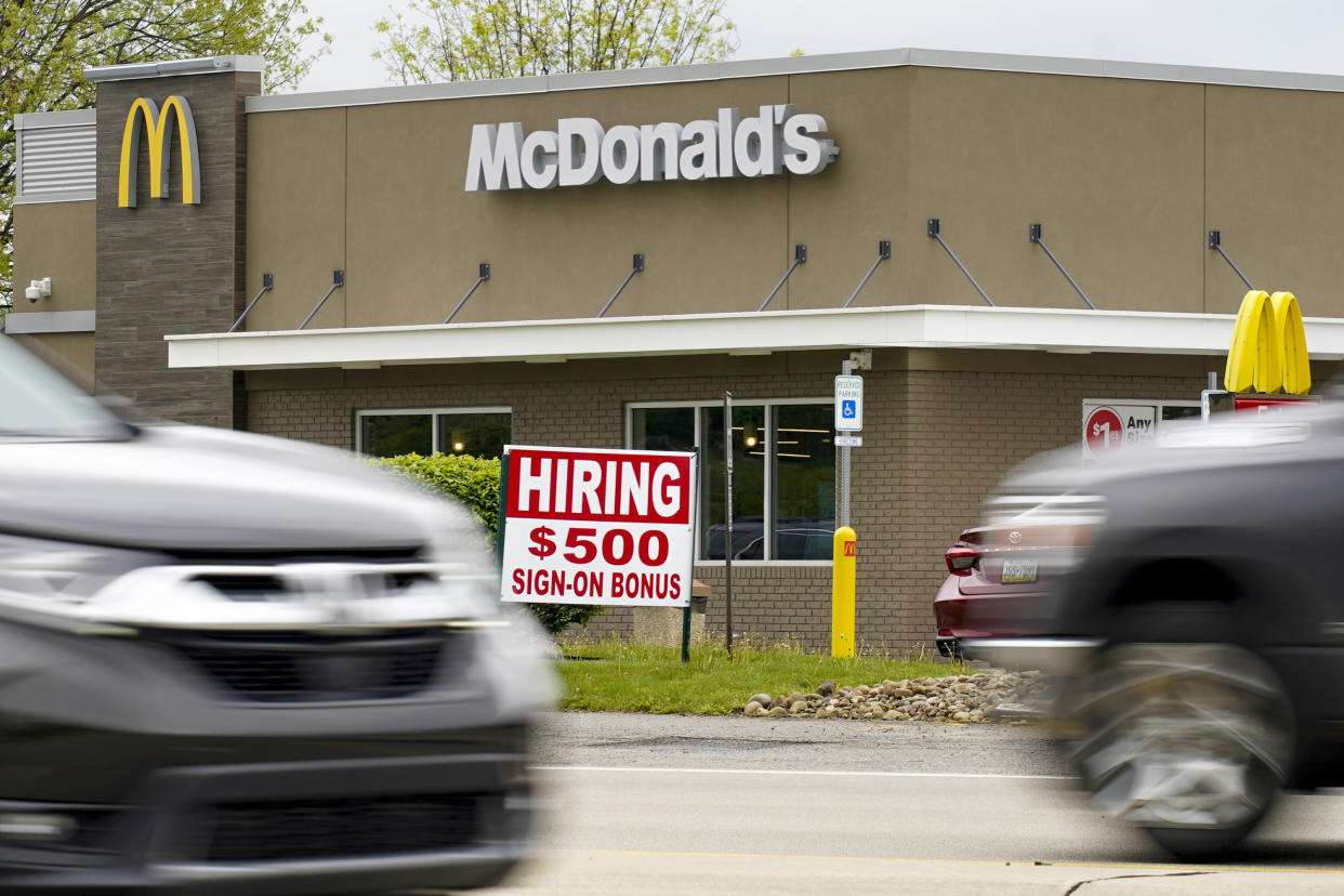 A hiring sign offers a $500 bonus outside a McDonald's restaurant, in Cranberry Township, Butler County, Pa., Wednesday, May 5, 2021. A bill by Pennsylvania's Republican-controlled Legislature to reinstate work-search requirements for people claiming unemployment benefits cleared the House Labor and Industry Committee on a party-line vote Tuesday. The sponsor, Rep. Jim Cox of Berks County, said many employers are having trouble finding workers. (AP Photo/Keith Srakocic)