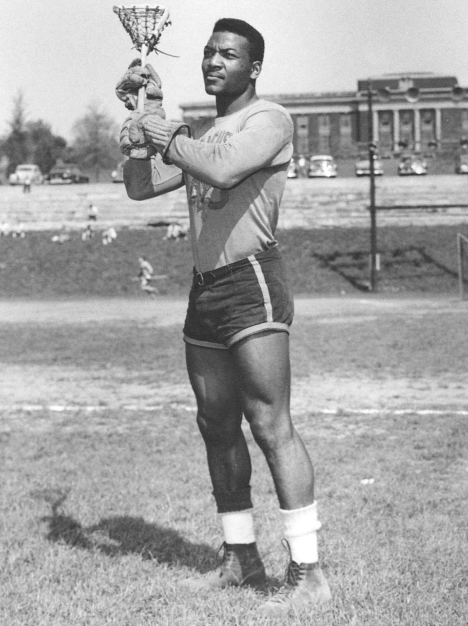 Jim Brown is shown playing in his last college lacrosse game for Syracuse University in this 1957 photo from Syracuse University.