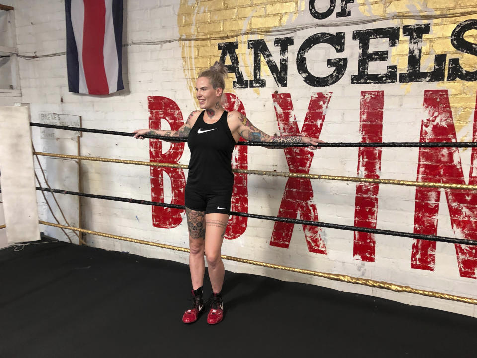 In this Thursday, Aug. 16, 2018 Bec Rawlings, of Australia, rests in the ring after a bare-knuckle sparring session at City of Angels Boxing Club in Los Angeles. Rawlings is a longtime UFC fighter who will fight on the second sanctioned bare-knuckle boxing show in the U.S. in over a century on Saturday, Aug. 25, in Biloxi, Miss. (AP Photo/Greg Beacham)