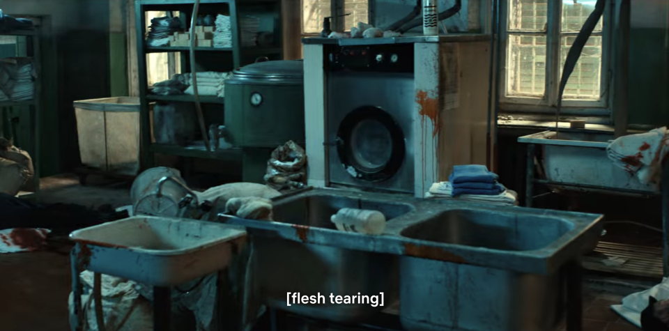 an abandoned room of old appliances and sinks