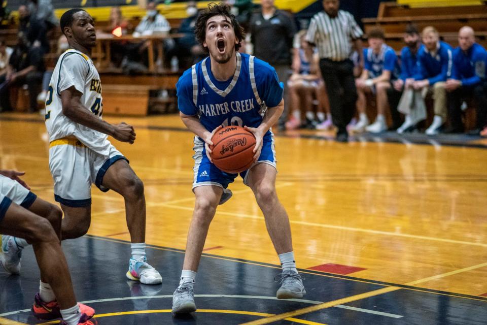 Harper Creek senior Zane Bowling (10) shoots the ball at the Battle Creek Central Fieldhouse on Tuesday, Jan. 25, 2022.