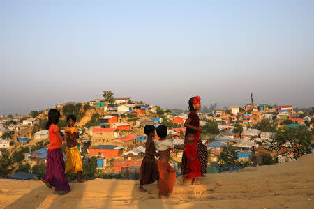 Rohingya refugee children walk along the road at Balukhali camp in Cox’s Bazar, Bangladesh, November 16, 2018. REUTERS/Mohammad Ponir Hossain/File Photo