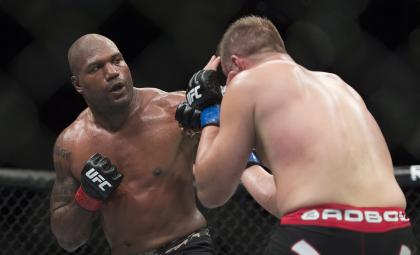 Rampage Jackson (L) lands a blow to the head of Fabio Maldonado at UFC 186. (AP)